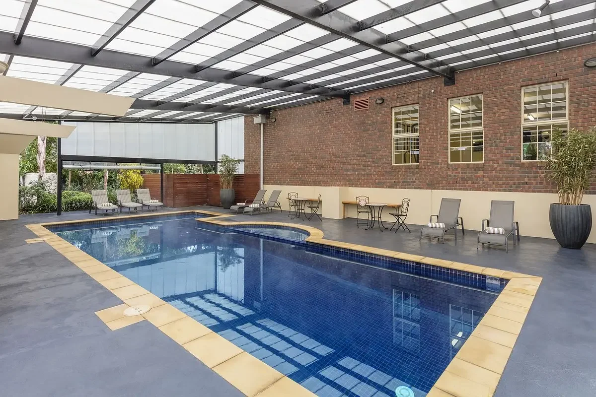 Outdoor lap pool before renovation